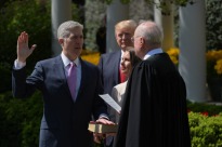 US President Donald Trump watches as Justice Anthony Kennedy(R) administers the oath of office to Neil Gorsuch as an associate justice of the US Supreme Court in the Rose Garden of the White House on April 10, 2017 in Washington, DC and Louise Gorsuch looks on. / AFP PHOTO / Mandel NGANMANDEL NGAN/AFP/Getty Images ORG XMIT: Justice A